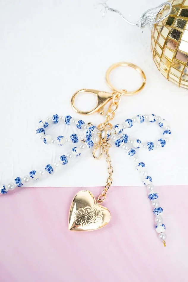 Crystal Avenue Openhearted Blue Flower Beaded Bow Keychain